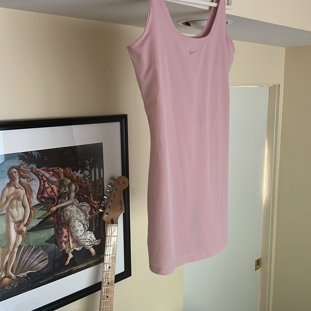 Nike Court tennis dress in medium pink, has built in shorts and bra All in one